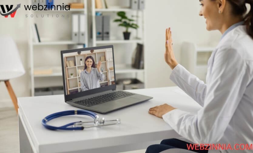 Dental marketing with virtual consultations: dentist waving to a patient on a laptop video call