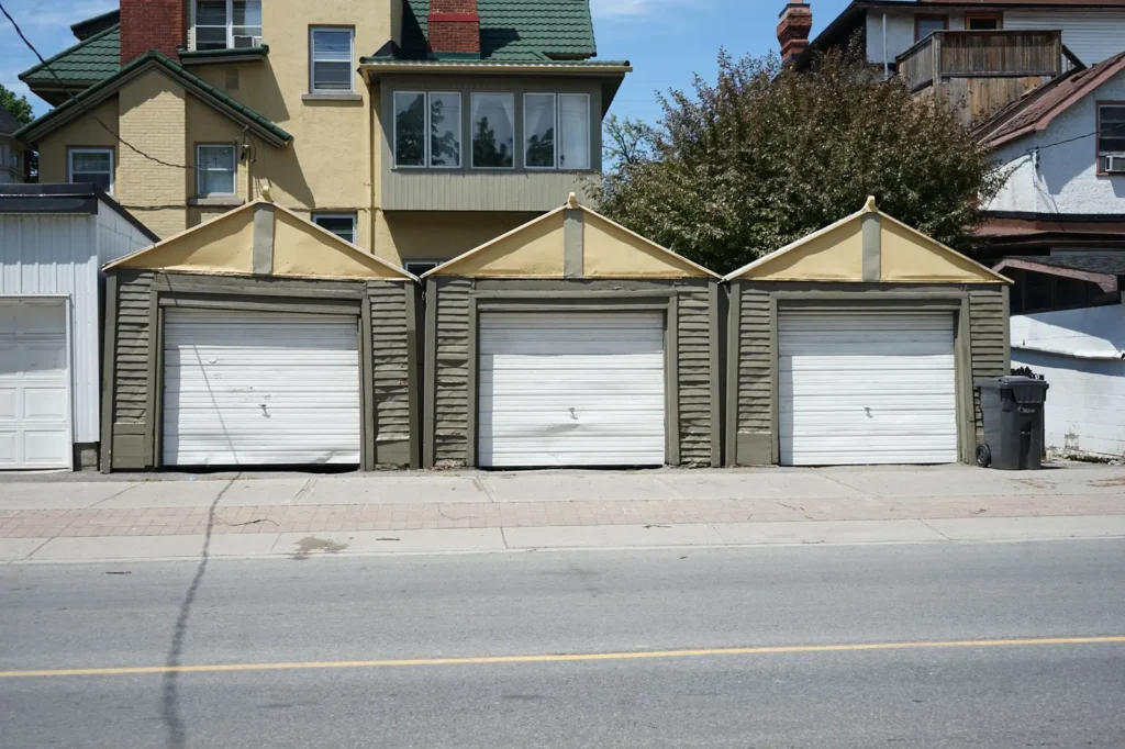 Garage door marketing: row of residential garage doors on a sunny street