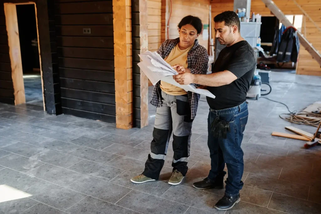 Contractors reviewing plans inside a home under renovation Local SEO Boca Raton: contractors reviewing plans inside a home under renovation